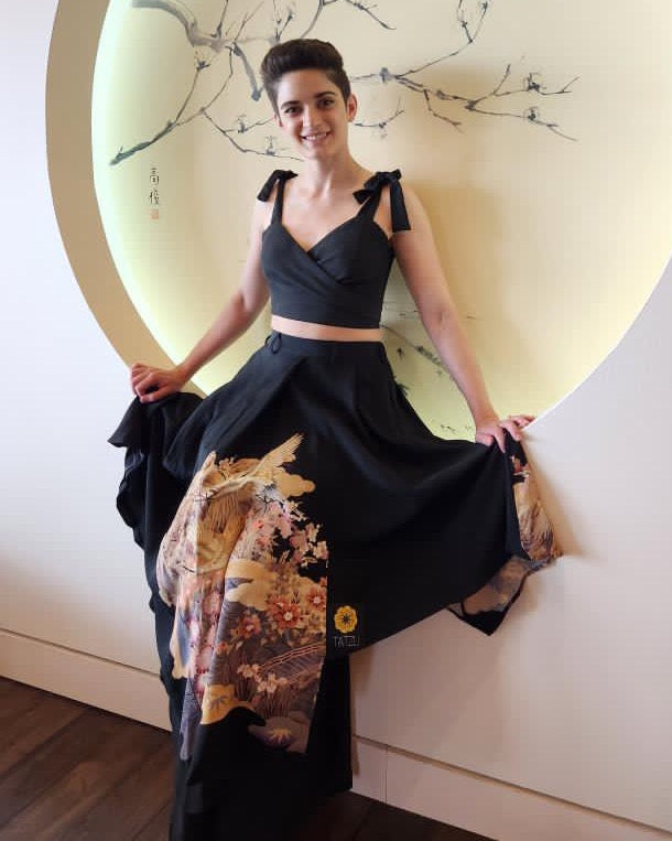 Customer wearing a custom TATZU kimono remake dress in a studio-style portrait.