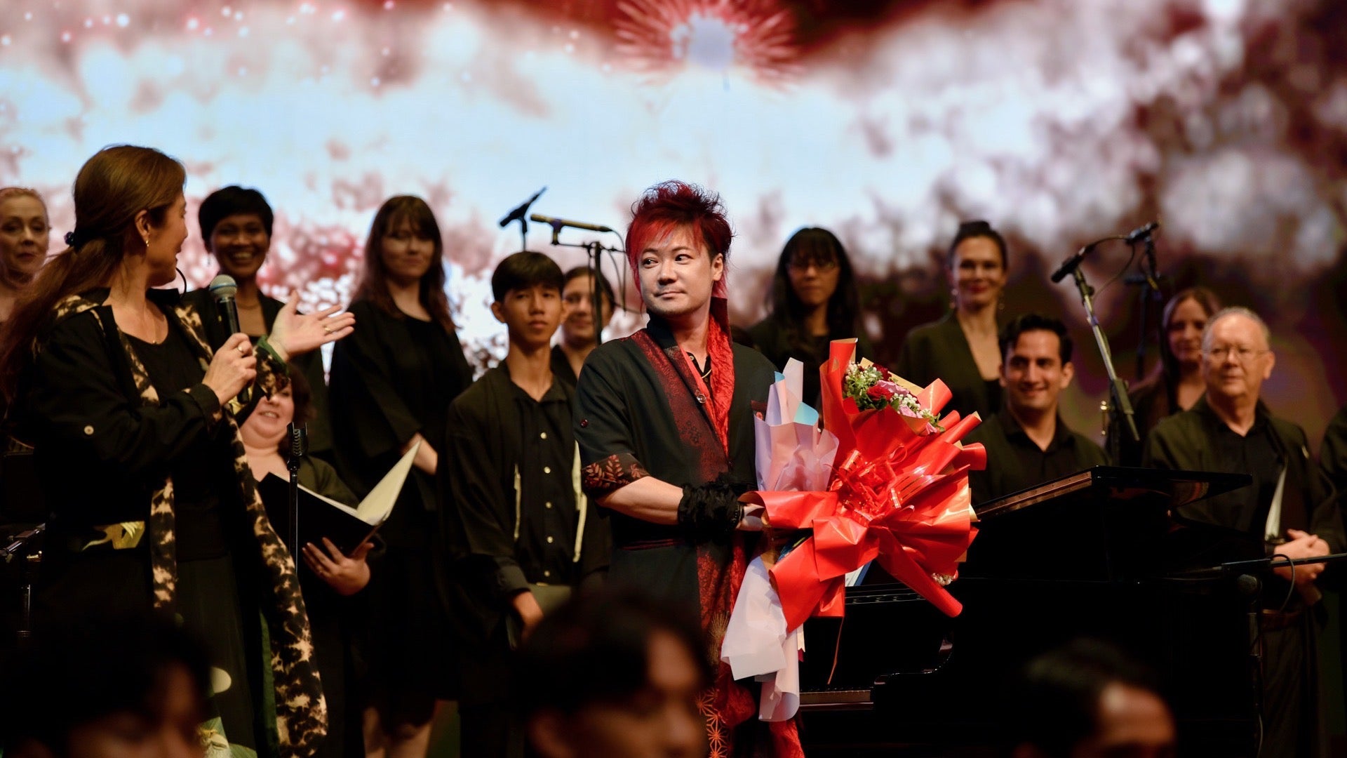 Wide-angle shot of the runway showcasing coordinated kimono remake outfits and dynamic movement.